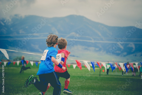 Boys running a race.