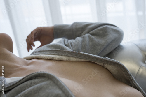 Young woman lying on the bed