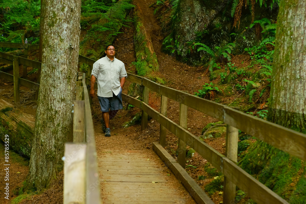 Man Walking Along Scenic Trail Man Walking Along Scenic Trail