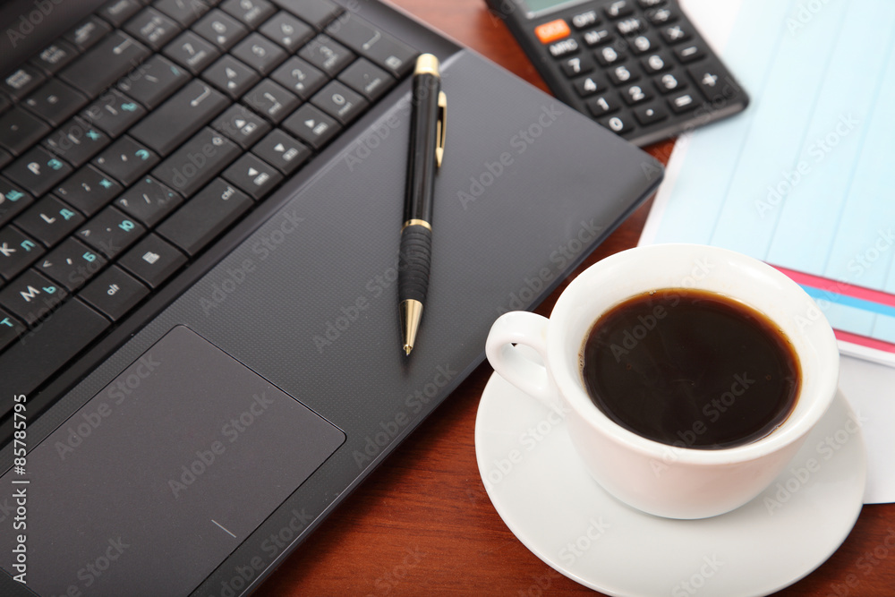 Calculator and cup of coffee on the financial documents Calculator and cup of coffee on the financial documents