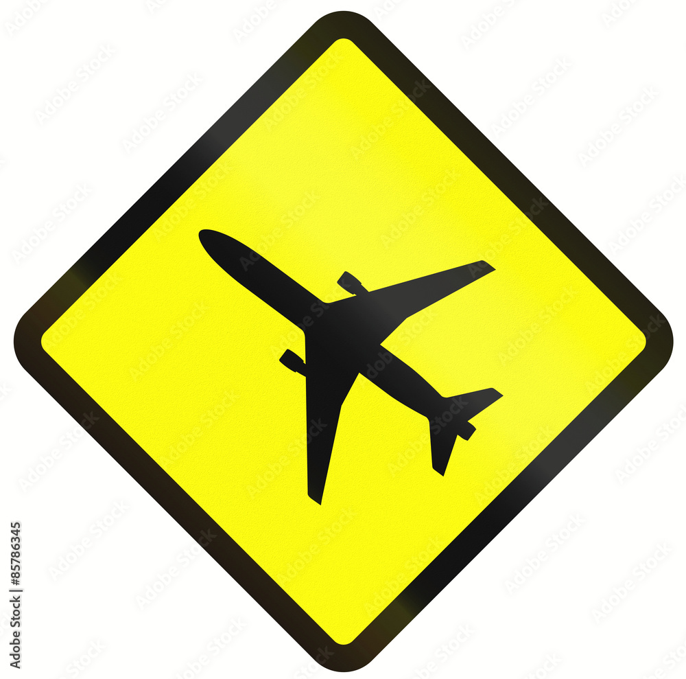 Warning road sign in Indonesia: Low flying airplanes Warning road sign in Indonesia: Low flying airplanes