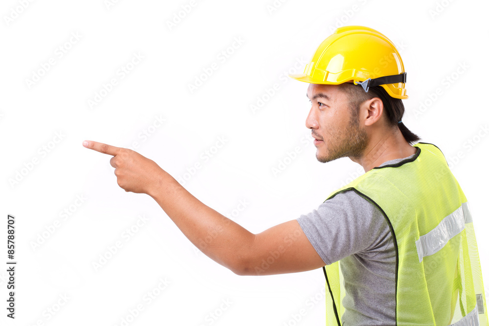 construction worker pointing sideway to blank space construction worker pointing sideway to blank space