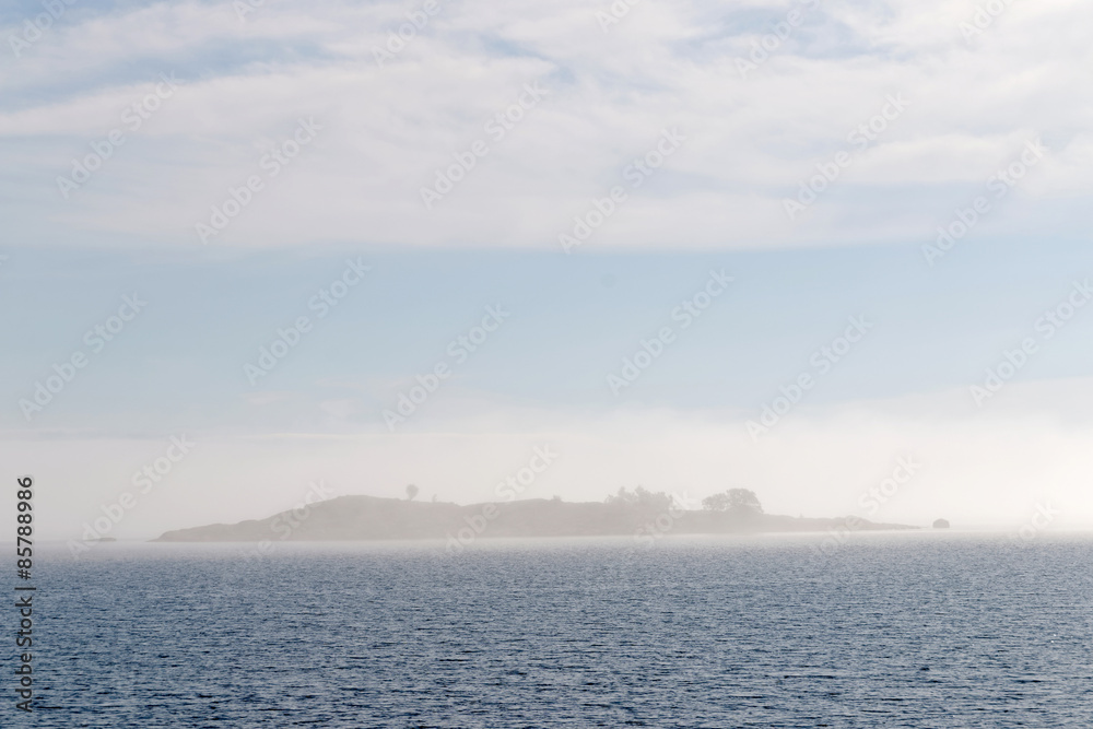 Fototapeta premium Island barly visible in the mist