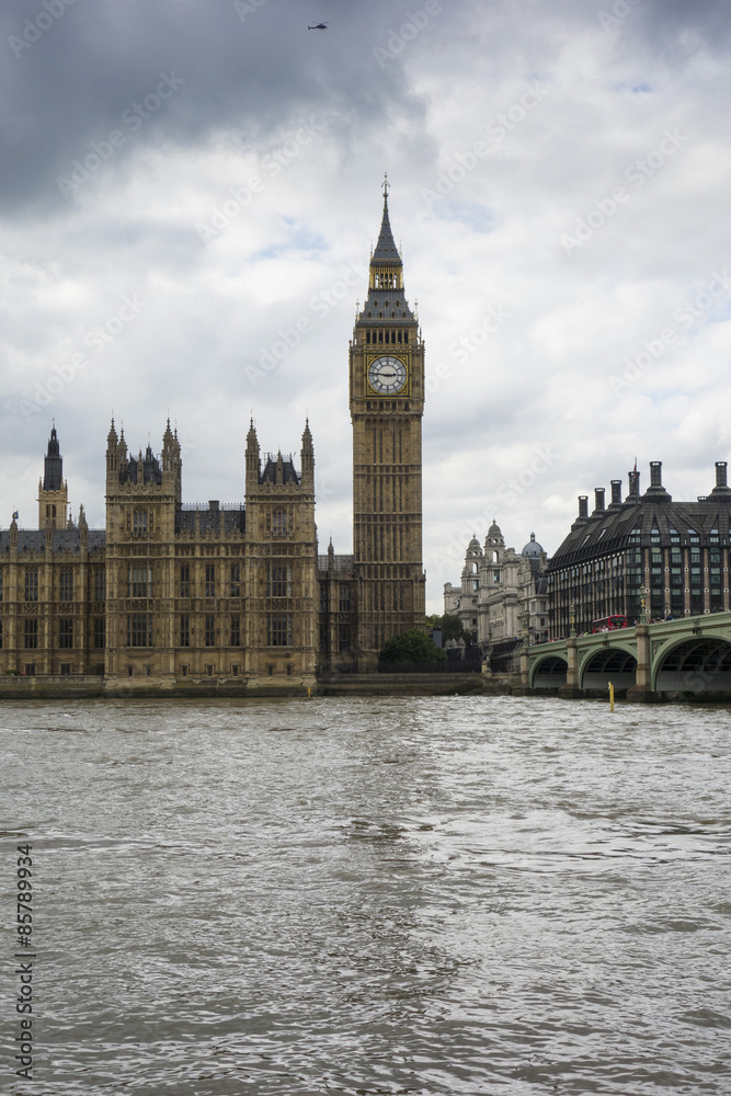 Big Ben, Houses of Parliament and the River Thames on a grey cloudy day London England