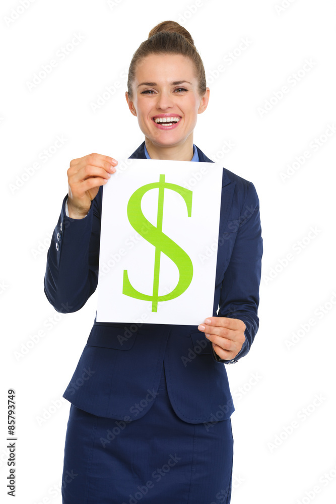 Happy businesswoman holding up sheet of paper with dollar sign Happy businesswoman holding up sheet of paper with dollar sign