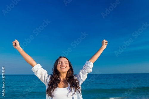 Happy woman smiling at the beach