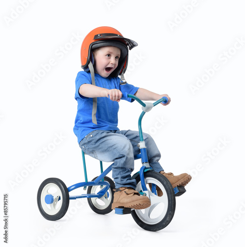 Little boy riding bicycle on white background