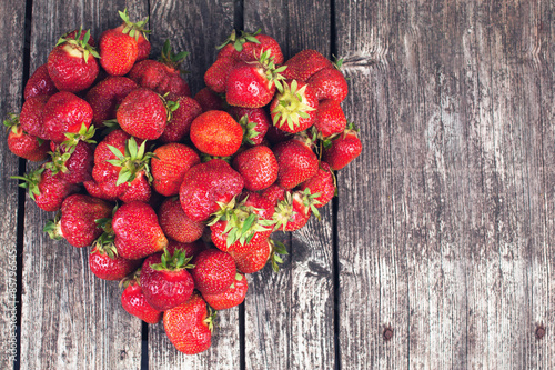 Farmer strawberries on dark background