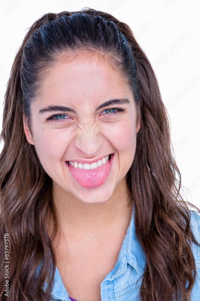 Happy brunette grimacing at camera Happy brunette grimacing at camera