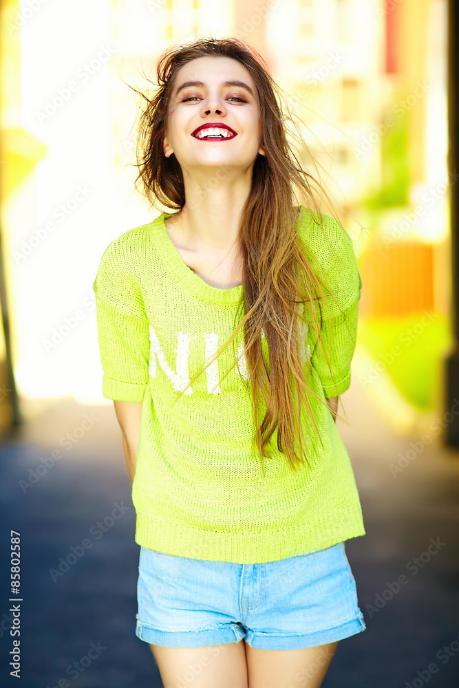 Funny  stylish sexy smiling beautiful young woman model in summer bright yellow   hipster cloth in the street