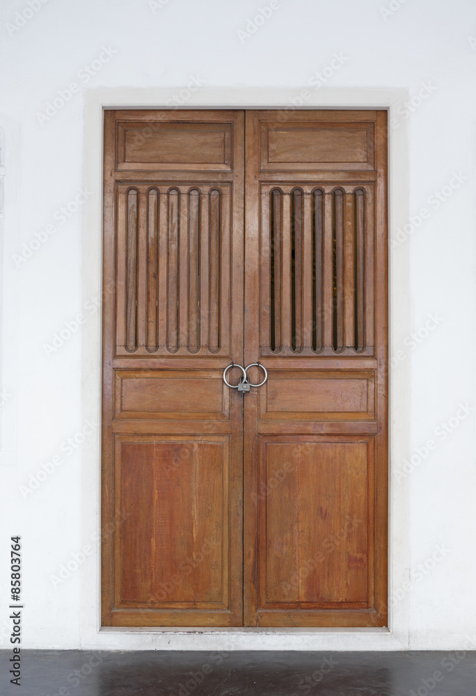 Closed old door in Chinese style on white background Closed old door in Chinese style on white background