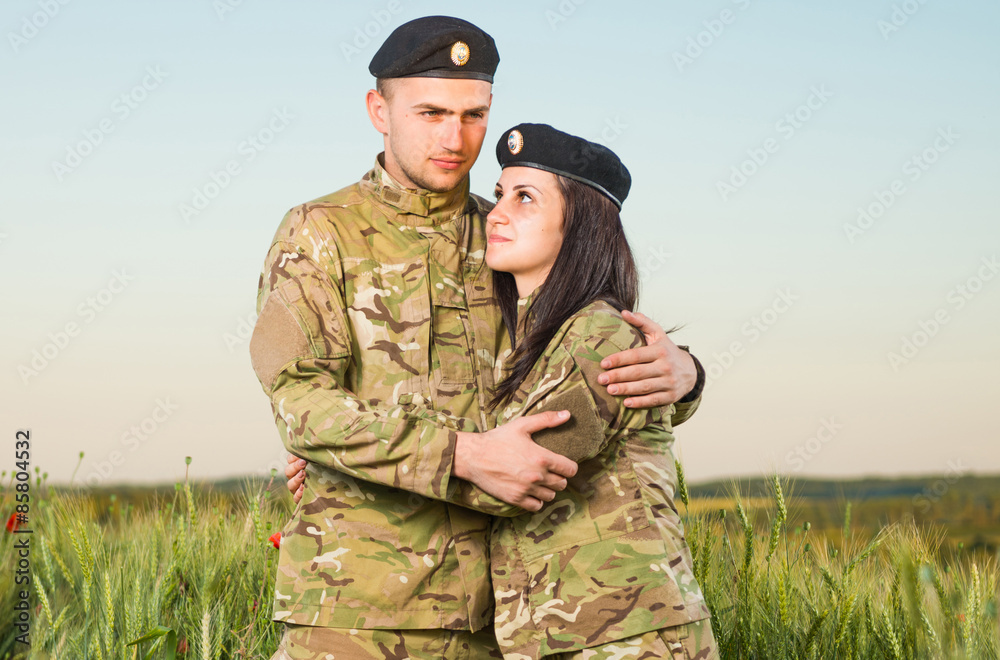 military couple at wheat field sunset