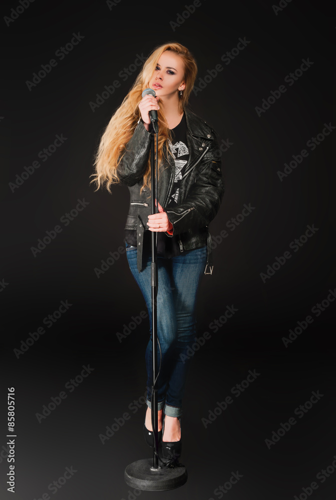 Beautiful blonde woman singing to microphone Beautiful blonde woman singing to microphone