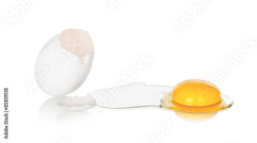   eggs on a white background. One egg is broken.