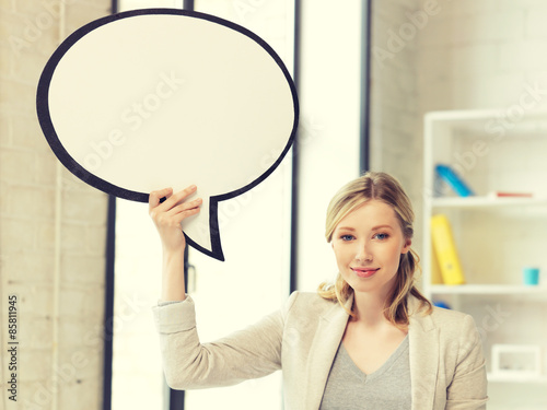 smiling businesswoman with blank text bubble
