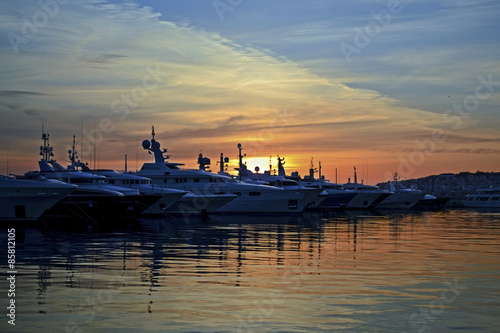 sunset behind the boats