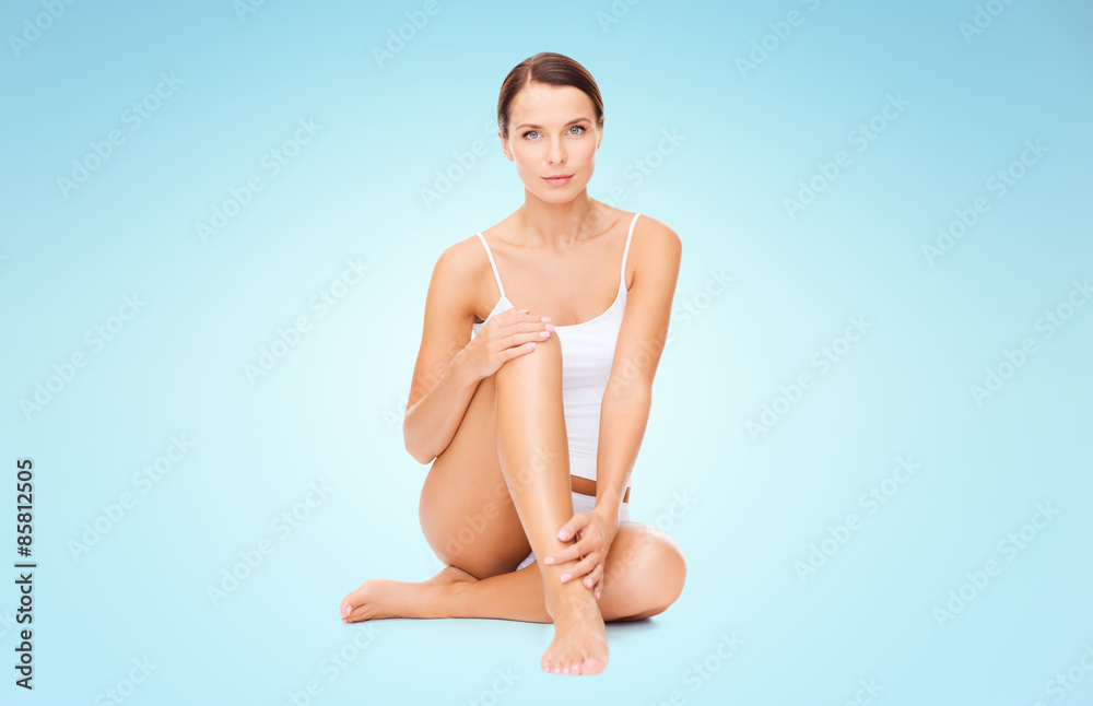 Obraz premium beautiful woman in cotton underwear touching legs