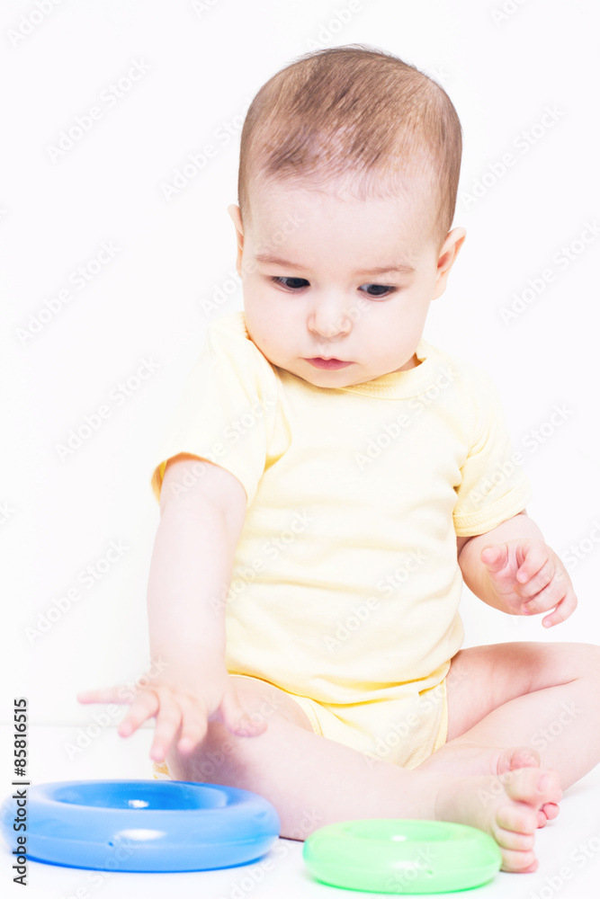 Beautiful baby playing with colorful toy
Beautiful baby playing with colorful toy