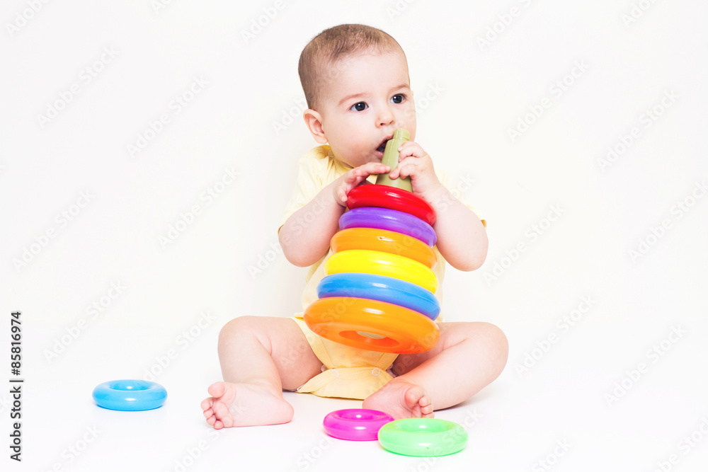 Beautiful baby playing with colorful toy
Beautiful baby playing with colorful toy