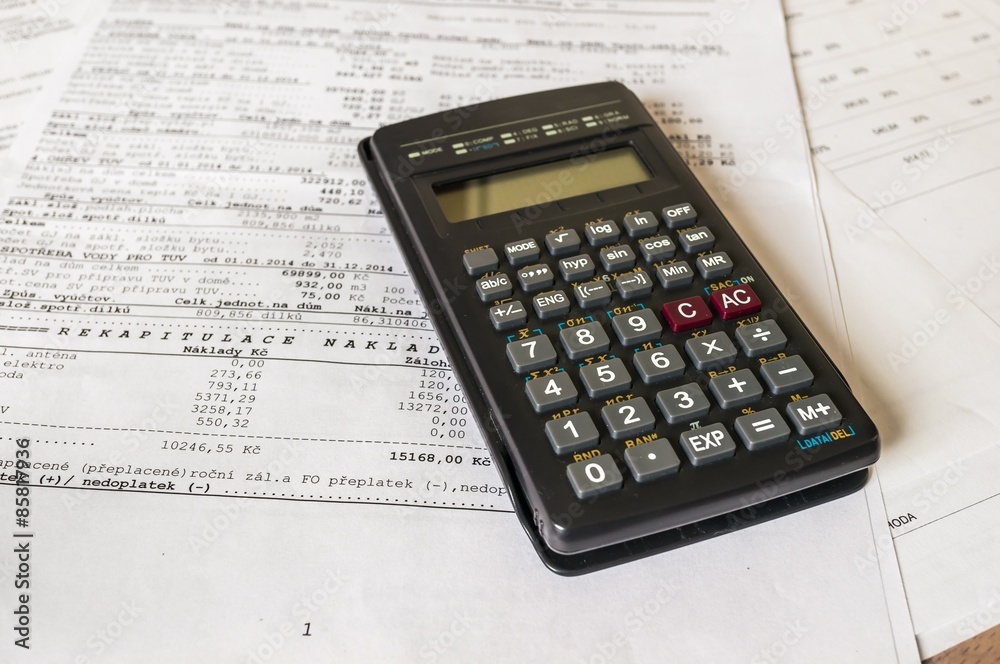 Real estate concept with mortgage loan and tax statement and calculator Real estate concept with mortgage loan and tax statement and calculator