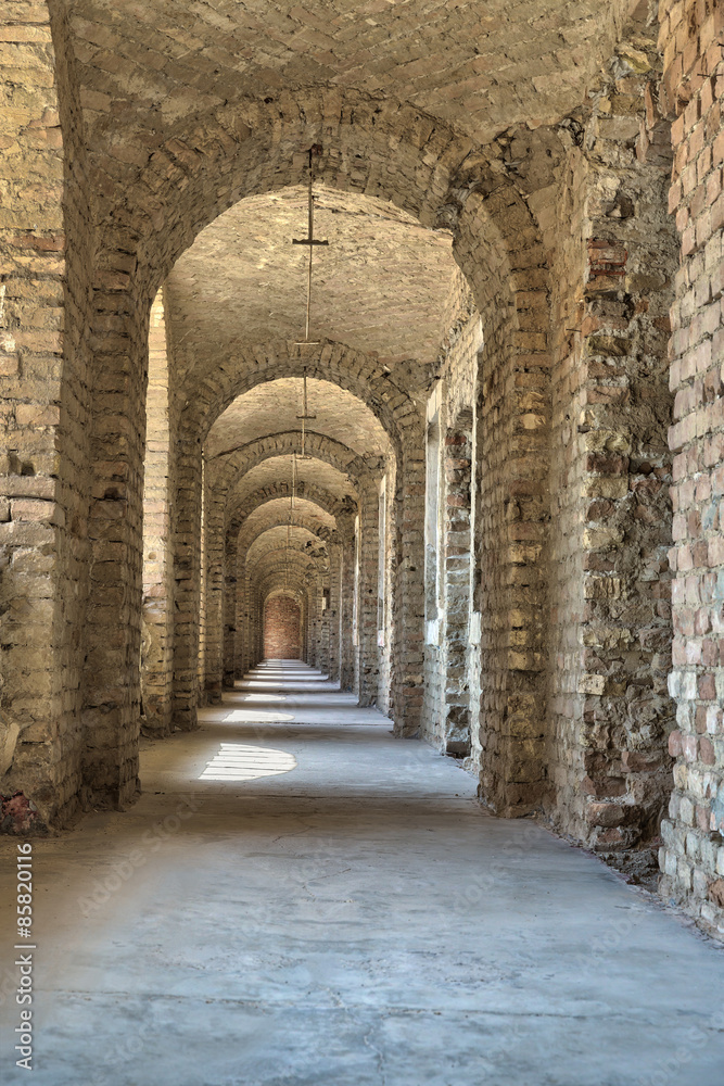 Castle tunnel with a series of arches in the ruined Bastion fortress in the Slovak city of Komarno.