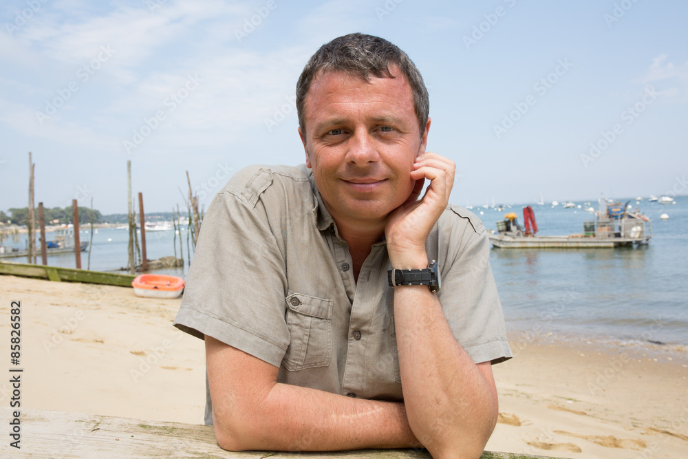Charming man at the beach on holidays Charming man at the beach on holidays