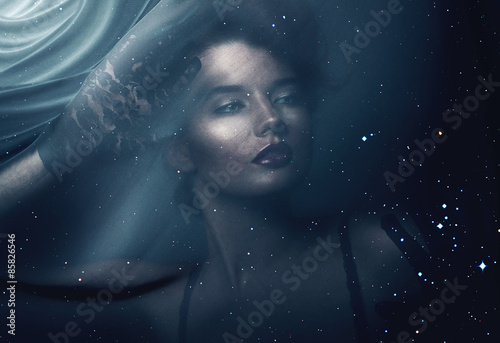 woman through black fabric with stars