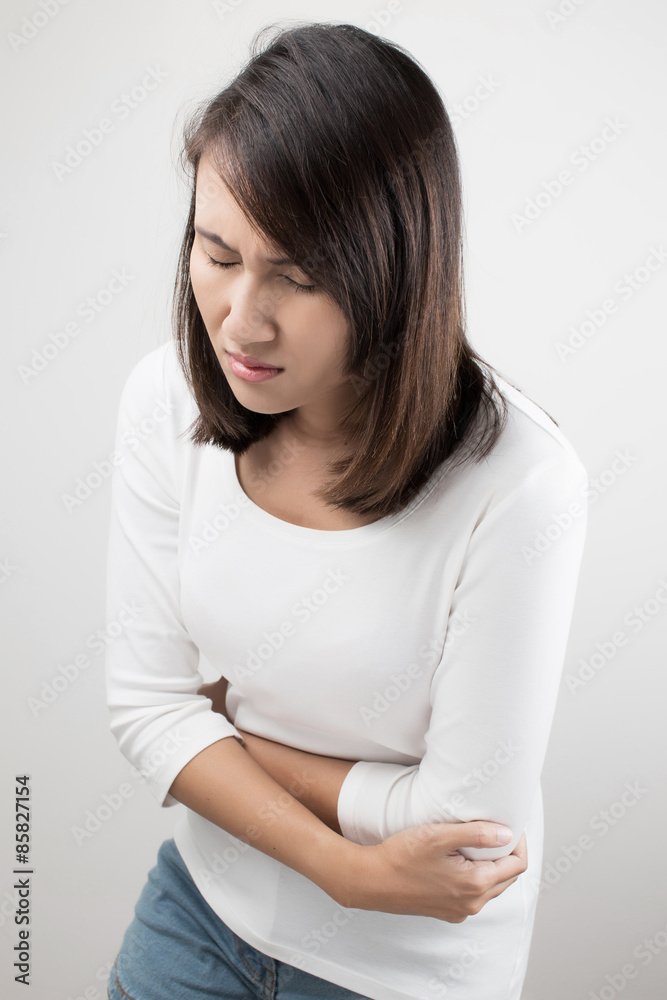 Woman with both palm around waistline to show pain and injury on Woman with both palm around waistline to show pain and injury on
