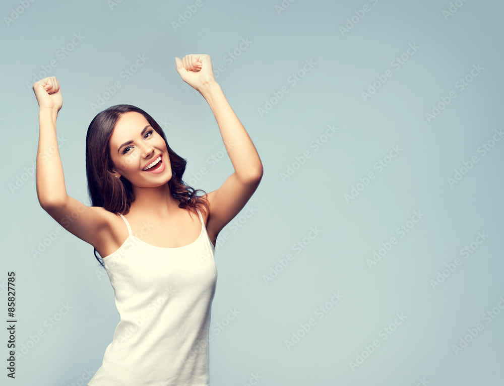 Happy gesturing young brunette woman, with copyspace Happy gesturing young brunette woman, with copyspace