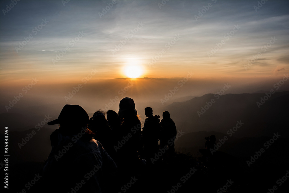 group people watching the sunset