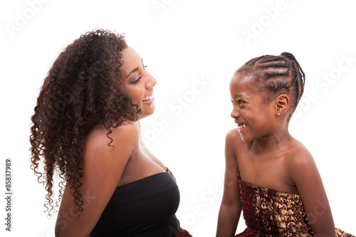African american mother with her daughter looking and smiling at
