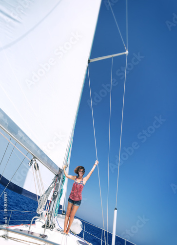 Happy woman on sailboat