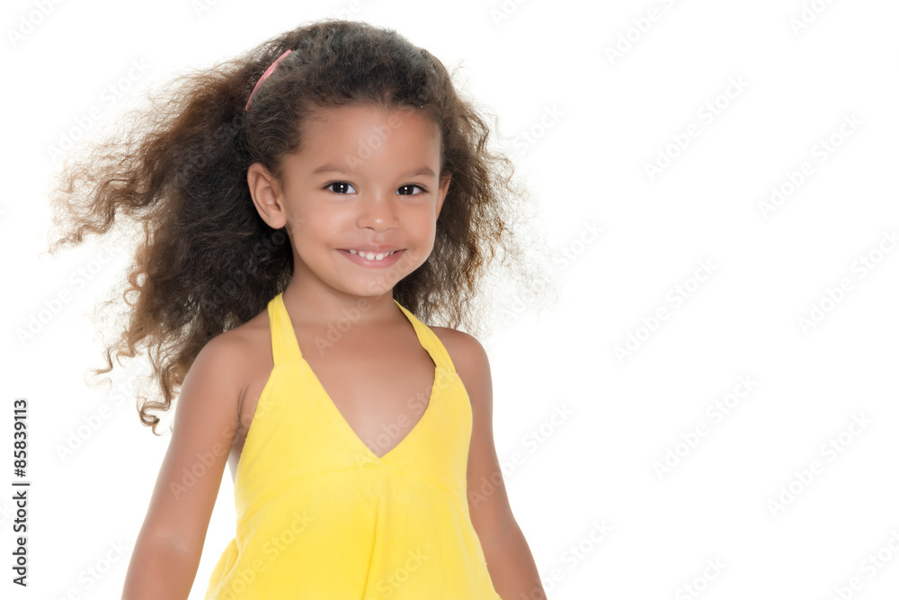 Small hispanic girl wearing a yellow summer dress Small hispanic girl wearing a yellow summer dress