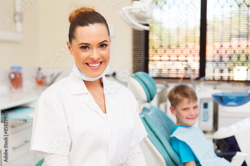 young female dentist and little patient