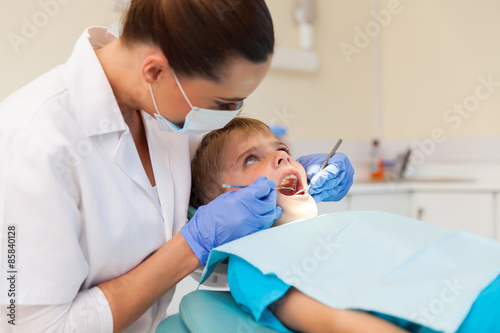 young boy getting his teeth examined