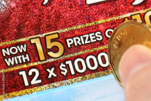 Close up woman scratching lottery ticket called set for life
