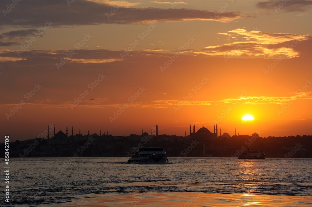 Sunset over Istanbul Silhouette with classic ferryboat Sunset over Istanbul Silhouette with classic ferryboat