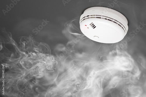 smoke detector of fire alarm in action photo