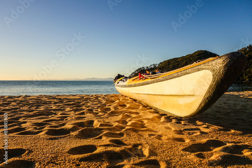 Kayak resting on the beach at Abel Tasman National Park