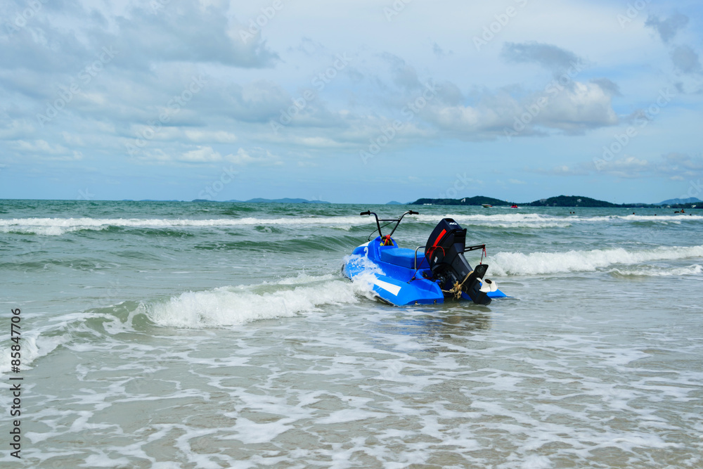 Blue scooter and sea