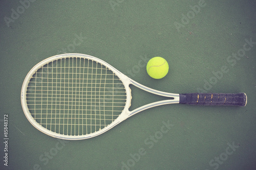 tennis racket and balls on the tennis court vintage color © FAMILY STOCK