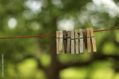 Pegs on the cord prepared for the clothes to be hanged