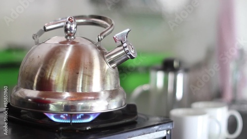 Compilation of Whistling Kettle Boiling on a Gas Stove - Still shot of a stainless steel whistling kettle boiling (no sound attached)