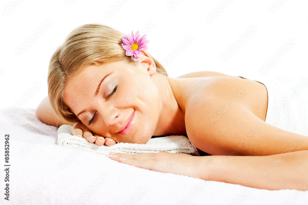 Young woman relaxing after massage on spa treatment Young woman relaxing after massage on spa treatment