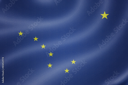 Alaska flag on the fabric texture background