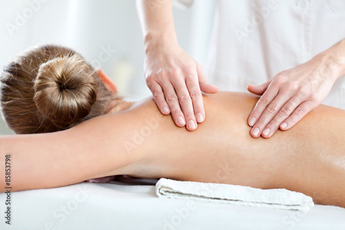 Young woman having massage on spa treatment