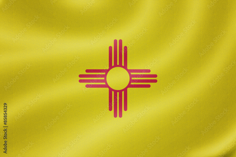 New Mexico flag on the fabric texture background New Mexico flag on the fabric texture background
