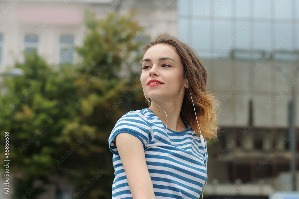 Girl in t-shirt listening to music