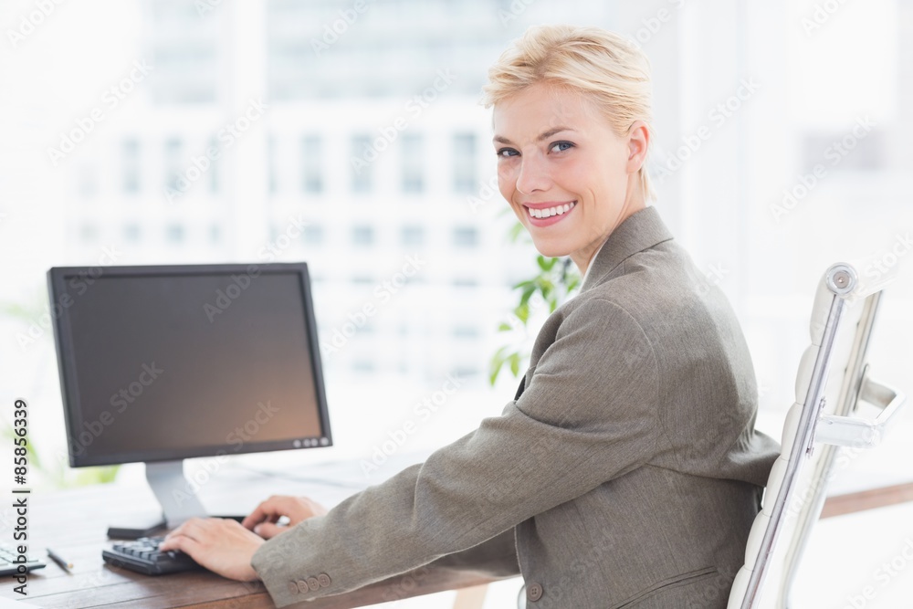 Smiling businesswoman looking at camera
