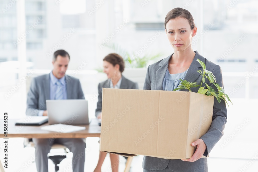 Businesswoman leaving office after being fired Businesswoman leaving office after being fired